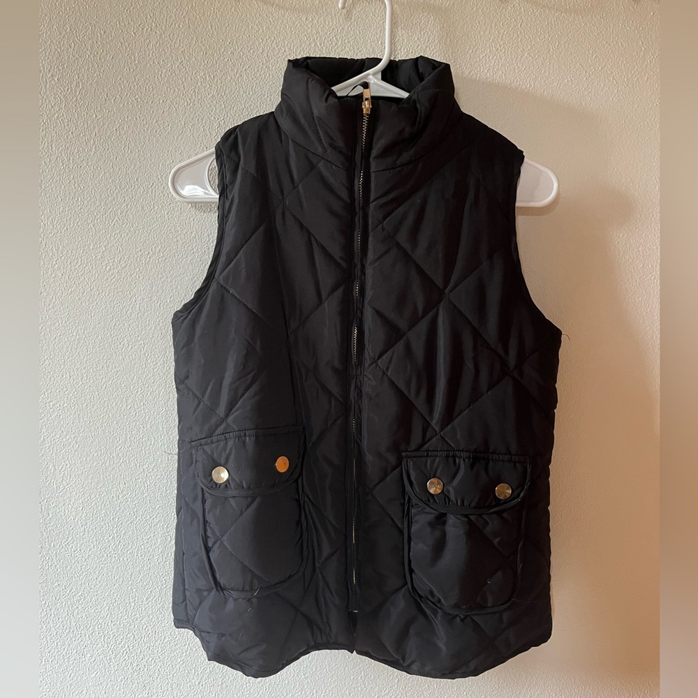 Black vest with gold zipper and buttons. Size M.